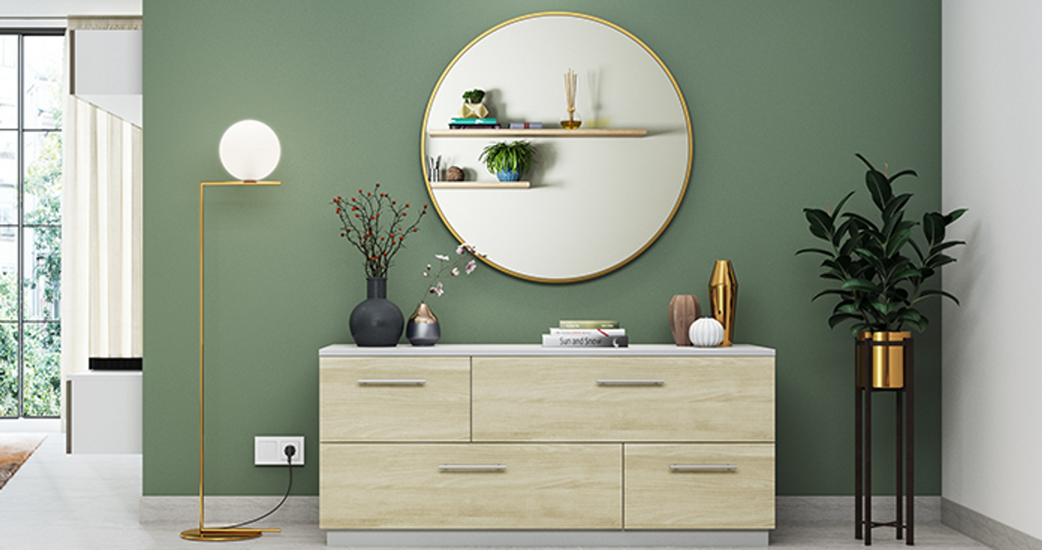 Modern foyer with sleek decor, minimalist furniture, and statement lighting.